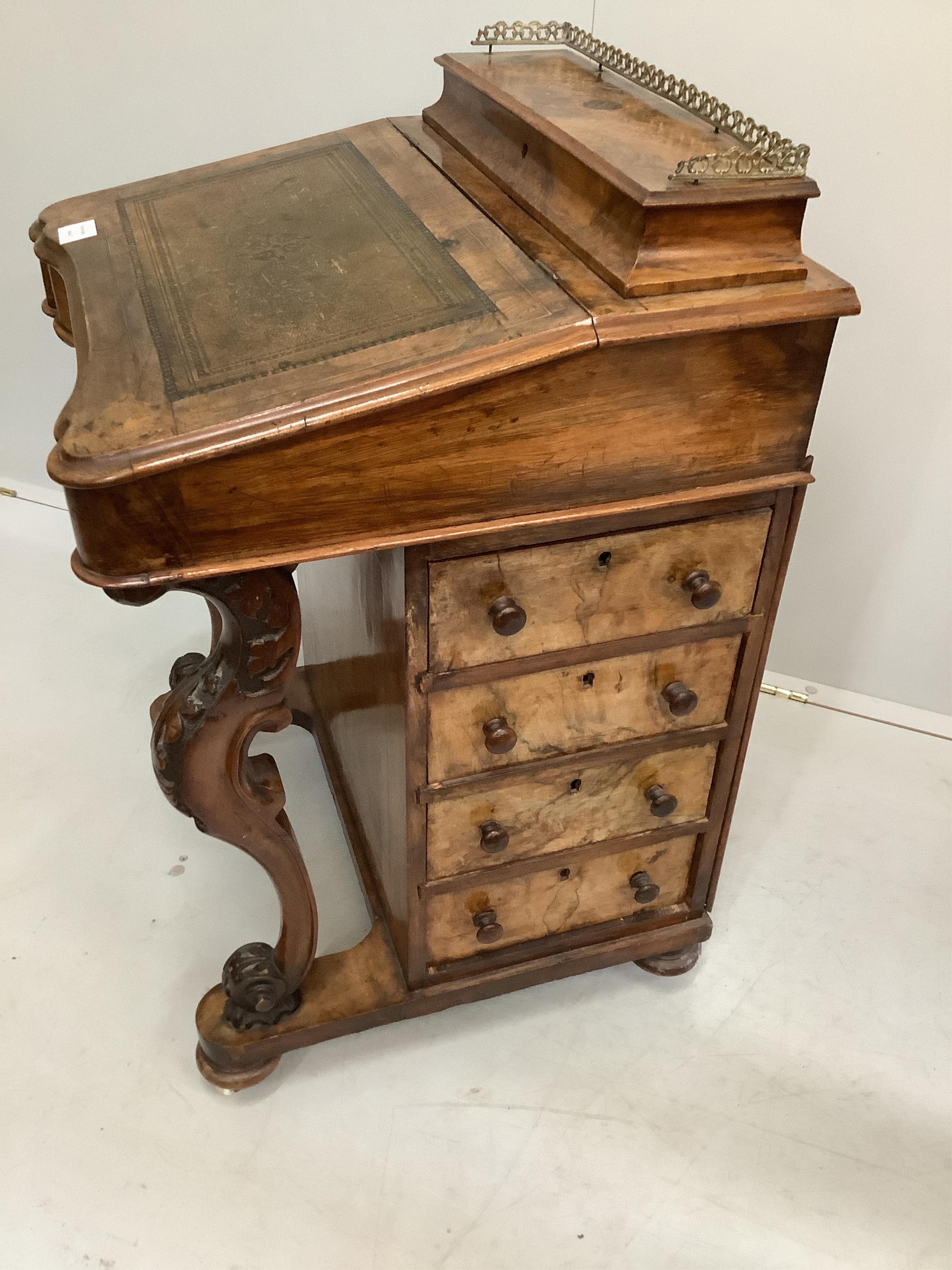 A Victorian walnut and marquetry inlaid Davenport, width 53cm, depth 53cm, height 82cm. Condition - fair